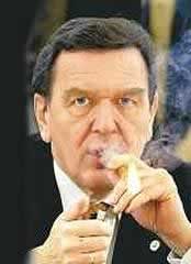 Gerhard Schröder, lighting up his cigar